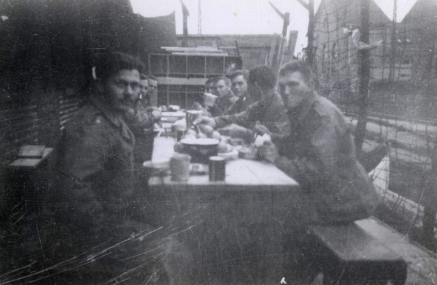 Soldiers Sharing a Meal at Outdoor Table, European Compound, WWII