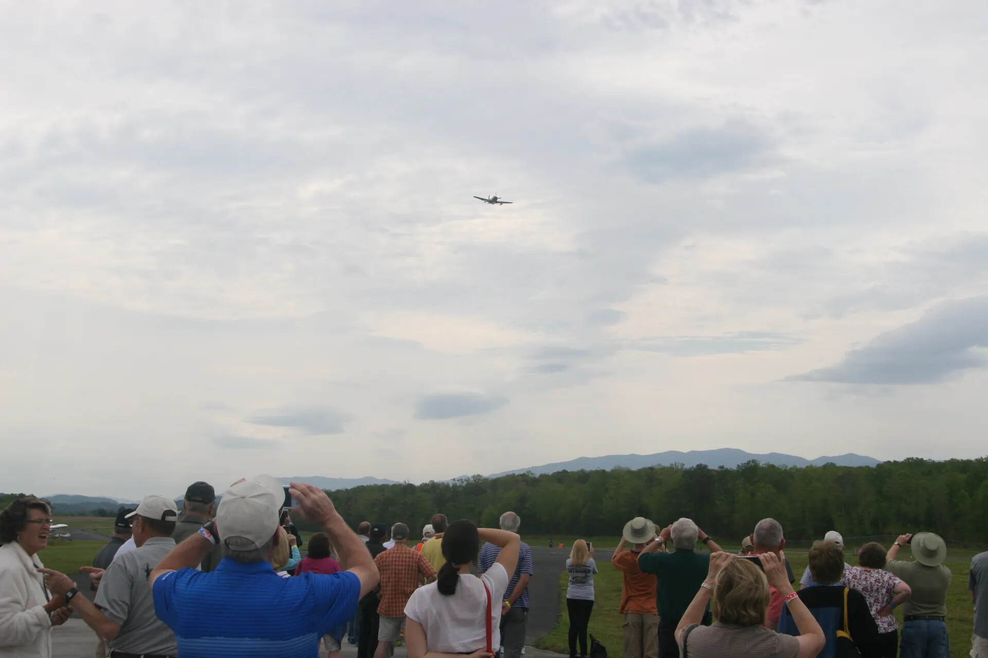 Spectators Watch A-1 Skyraider Bank Overhead at Operation Tailwind Commemorative Event, 2016