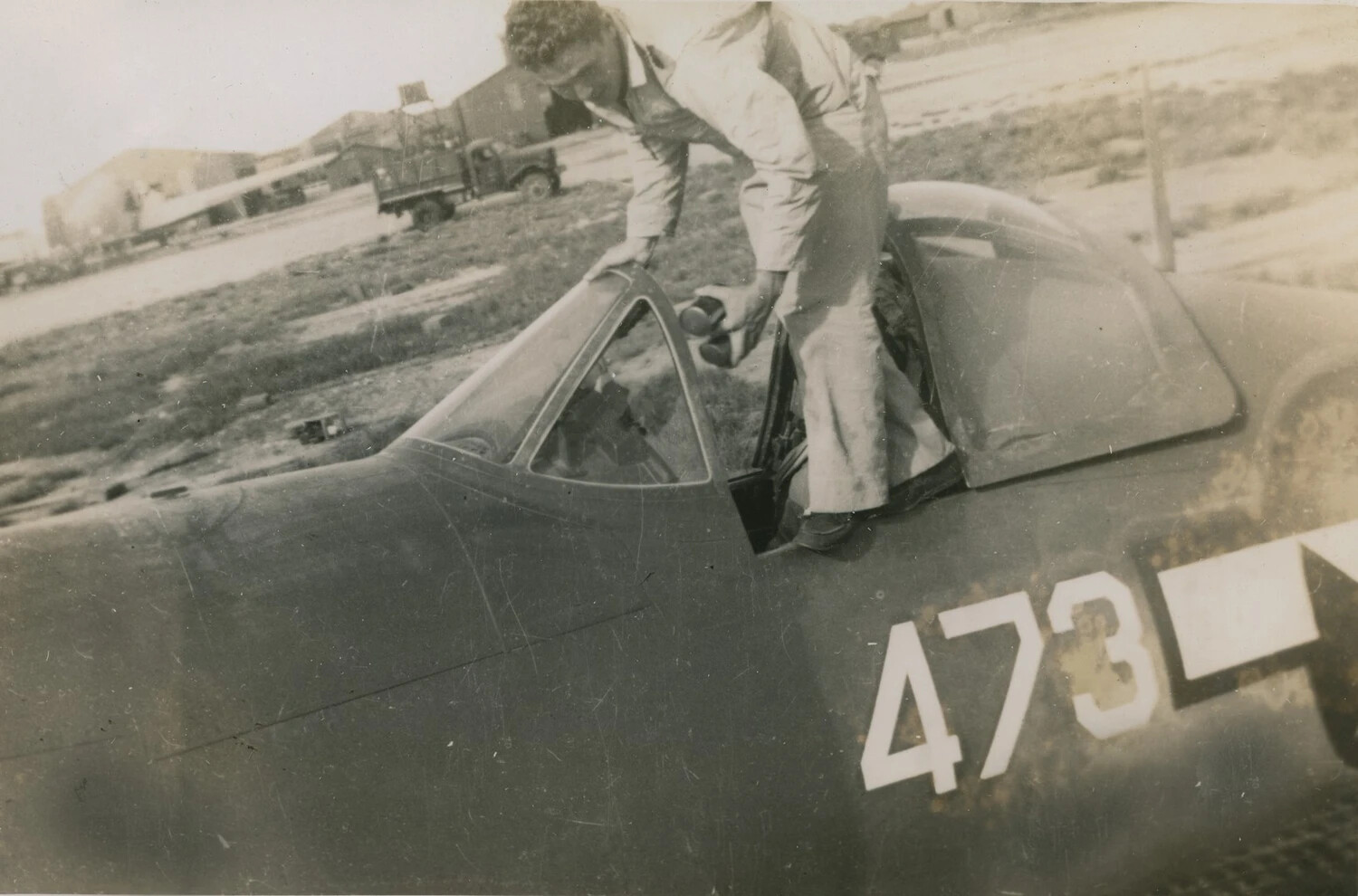 U.S. Navy Aviator Inspecting Fighter Aircraft Cockpit, Tail Number 473, WWII Era