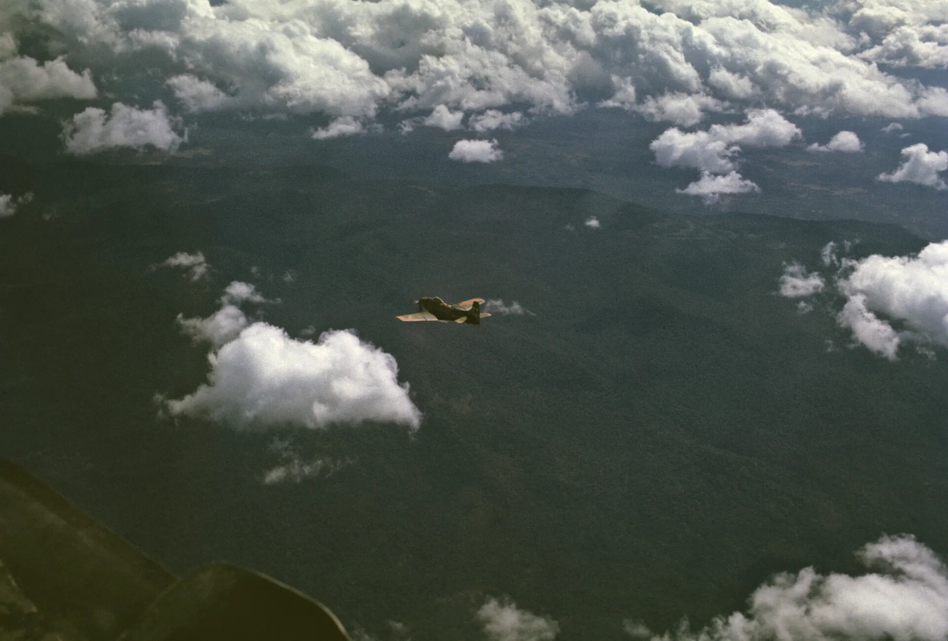 A-1 Skyraider in Banking Turn Over Southeast Asian Jungle, Vietnam War Era