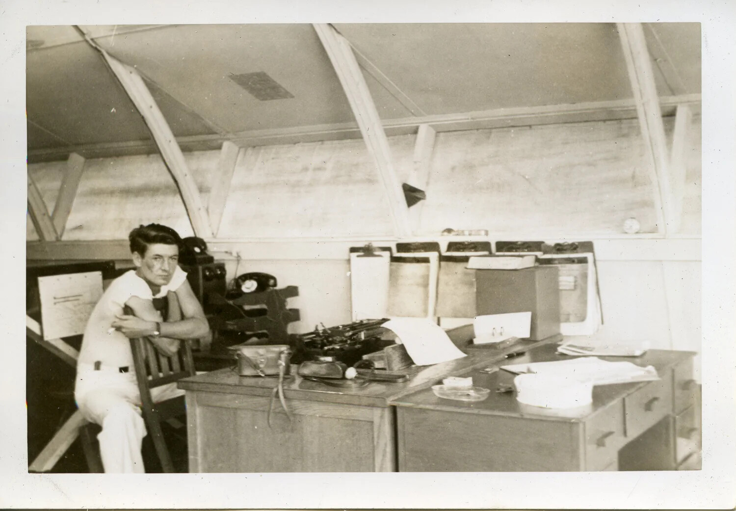 Sailor at Operations Desk Inside Quonset Hut, VR-6 Naval Air Transport Squadron, Agana, Guam