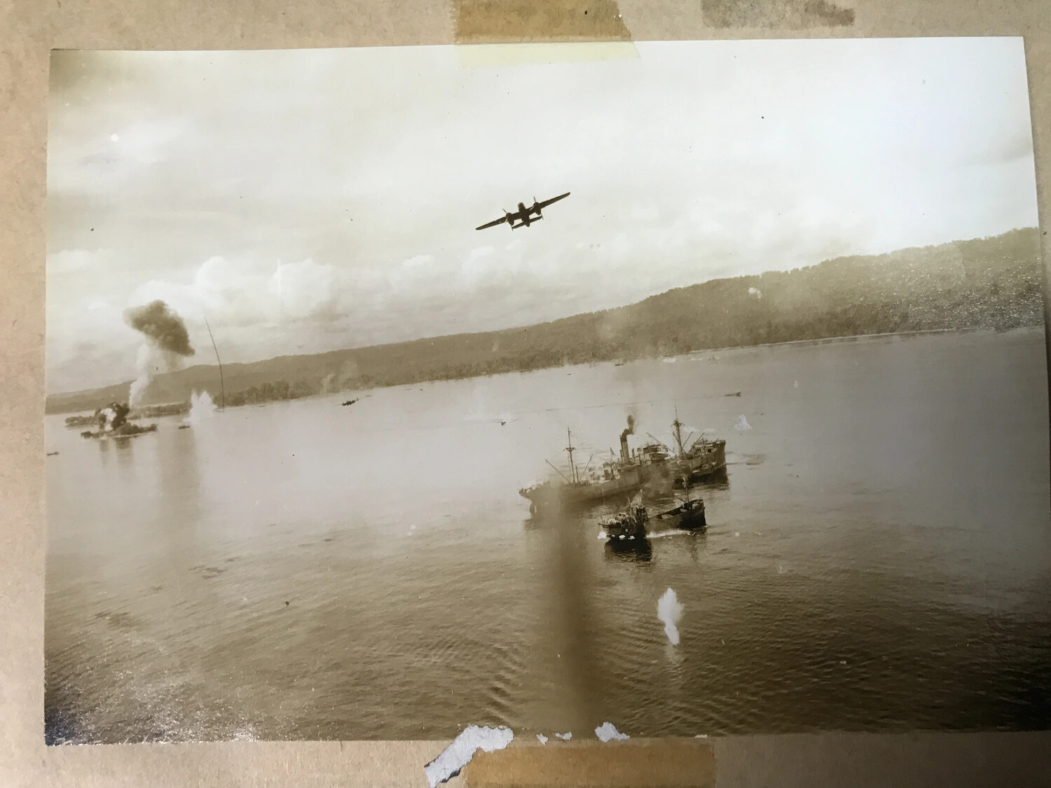 Album-Mounted Photograph: B-25 Mitchell Departing a Strike on Japanese Shipping