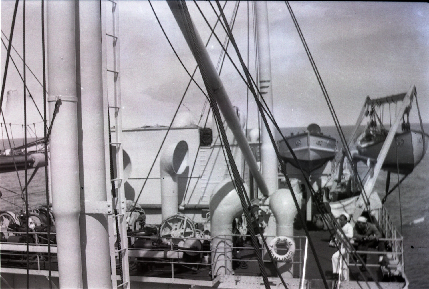 Shipboard View of Deck Rigging and Lifeboat Davits Aboard USAT/USS Chaumont