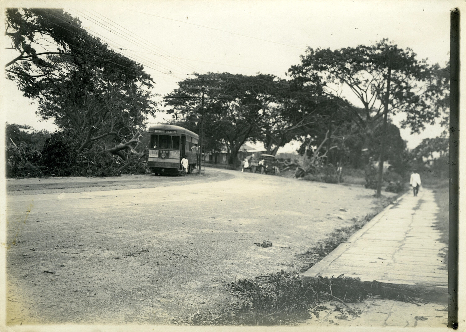 Typhoon-Damaged Street Scene with Electric Tram, Manila Vicinity, Philippines, Early 1900s - Carl Stone Collection
