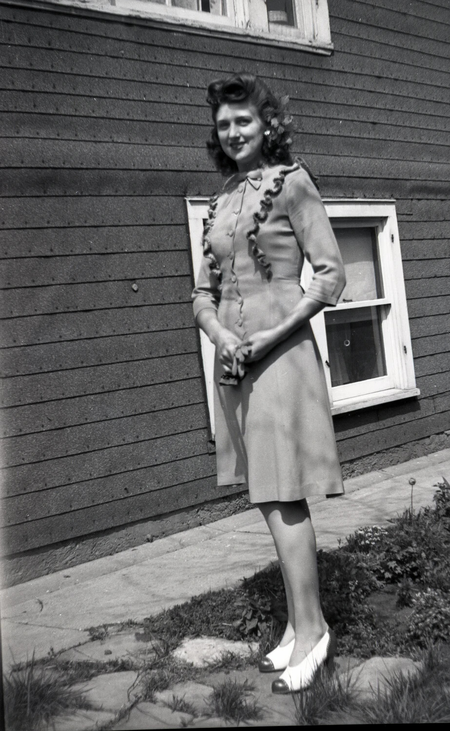 Portrait of a Young Woman in 1940s Dress, Residential Setting