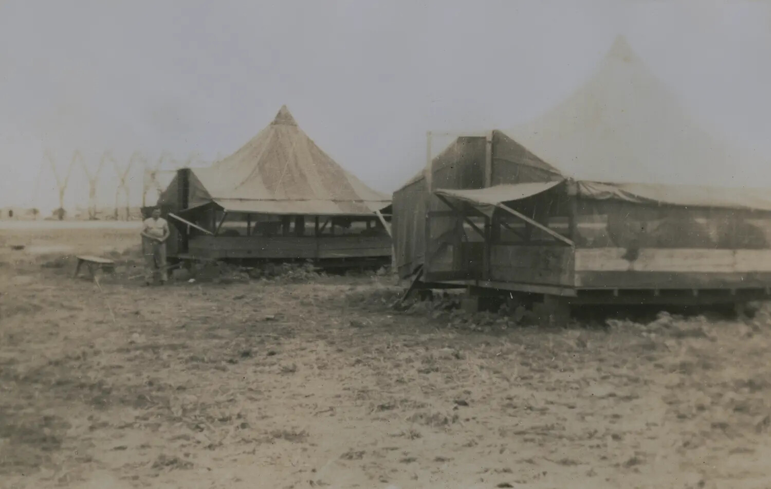Pyramidal Tents on Raised Wooden Platforms at Military Encampment, WWII Era