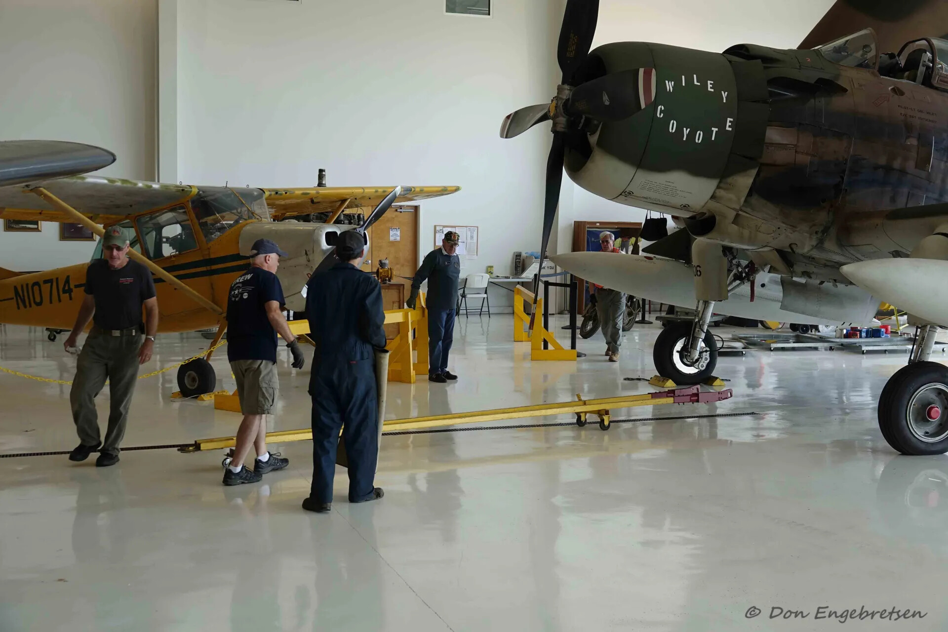 Museum Volunteers Prepare A-1 Skyraider 'Wiley Coyote' for Display, Aviation Museum Hangar, May 2019
