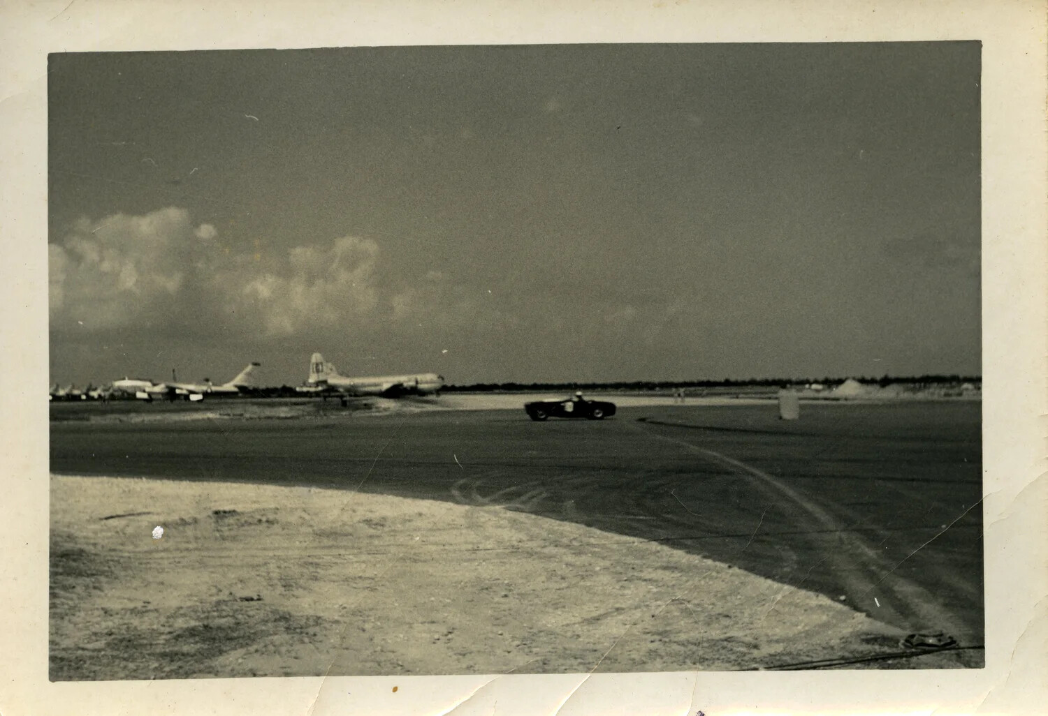 Four-Engine Piston Aircraft on Airfield Ramp, Likely Hickam Field, Mid-20th Century