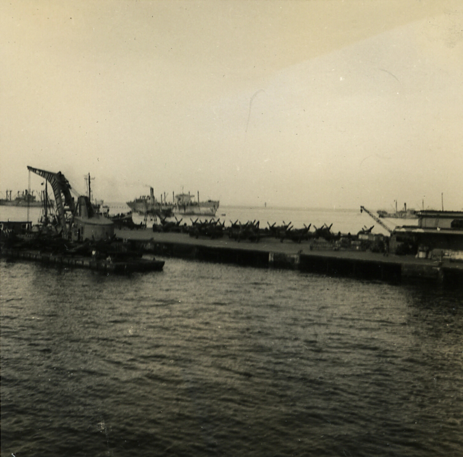 Rows of Surplus Single-Engine Aircraft Stored on a Harbor Pier, Post-War Japan