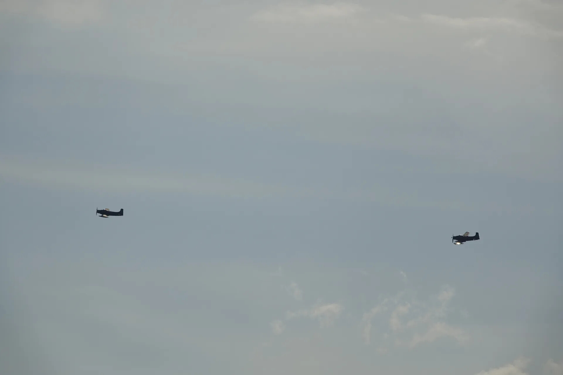 Two Douglas A-1 Skyraiders in Formation Flight, Overcast Sky, May 2019 Airshow Event