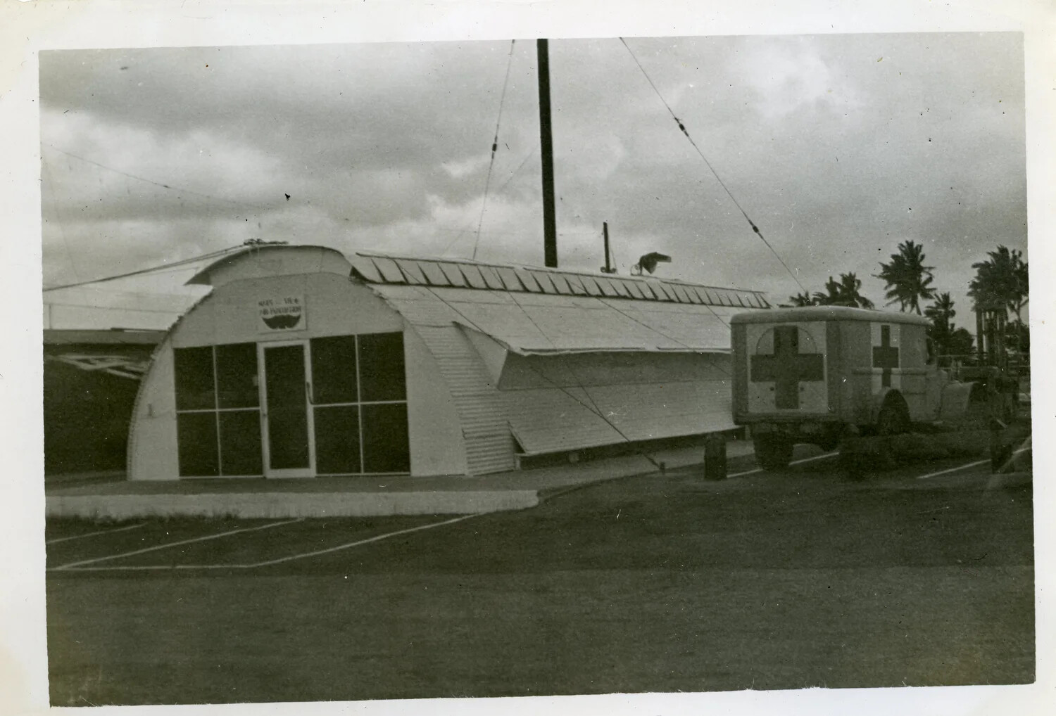 Quonset Hut Facility with Red Cross Ambulance, Naval Air Transport Squadron VR-6, Agana, Guam