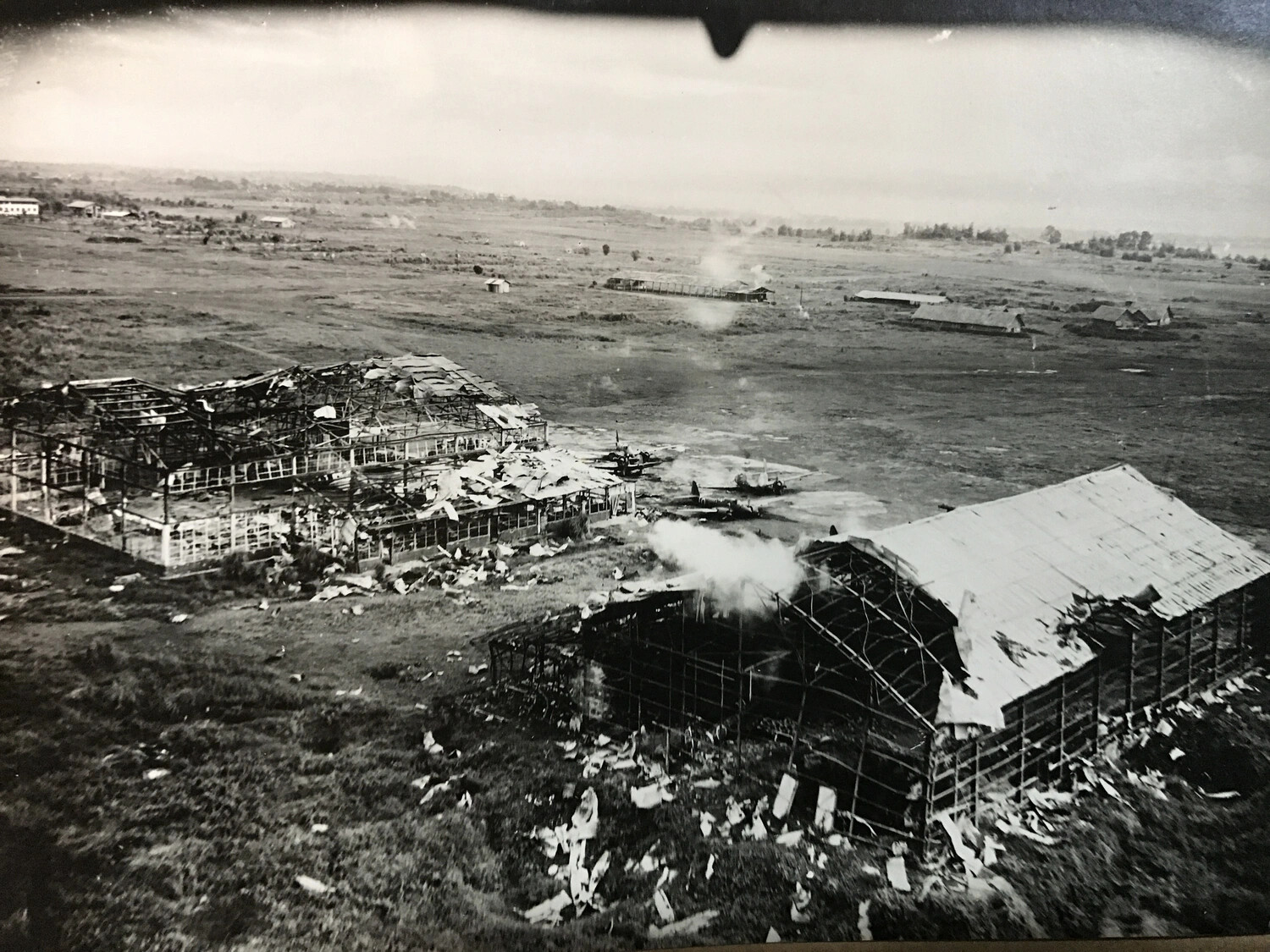Destroyed Hangars and Parked Aircraft at Japanese Airfield, Aerial View