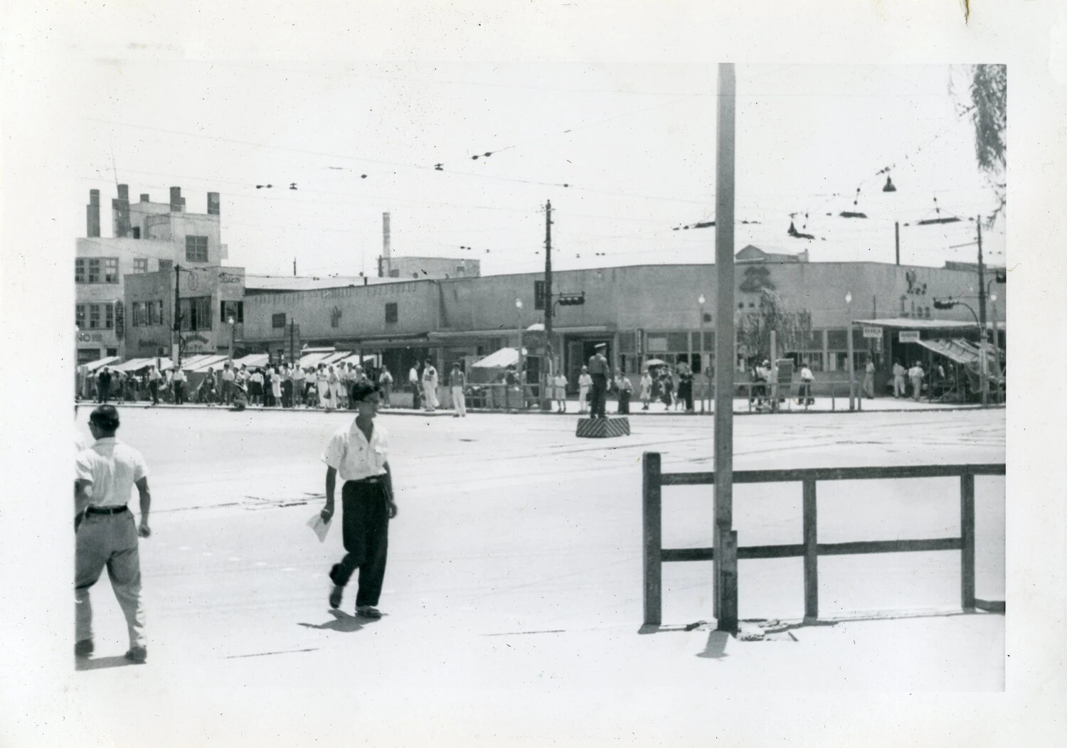 Manila Street Scene with Trolley Wires and Traffic Pedestal, VR-6 Squadron Photo Album, Postwar Philippines