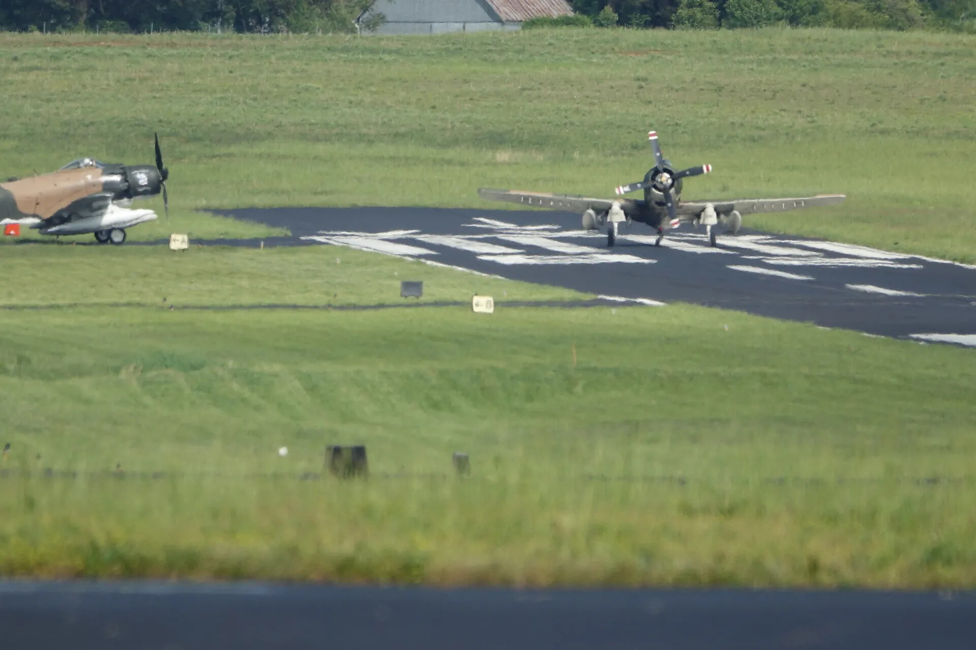 Two Warbird Aircraft on Taxiway with Closed-Runway Marking, May 2019 Airshow Event