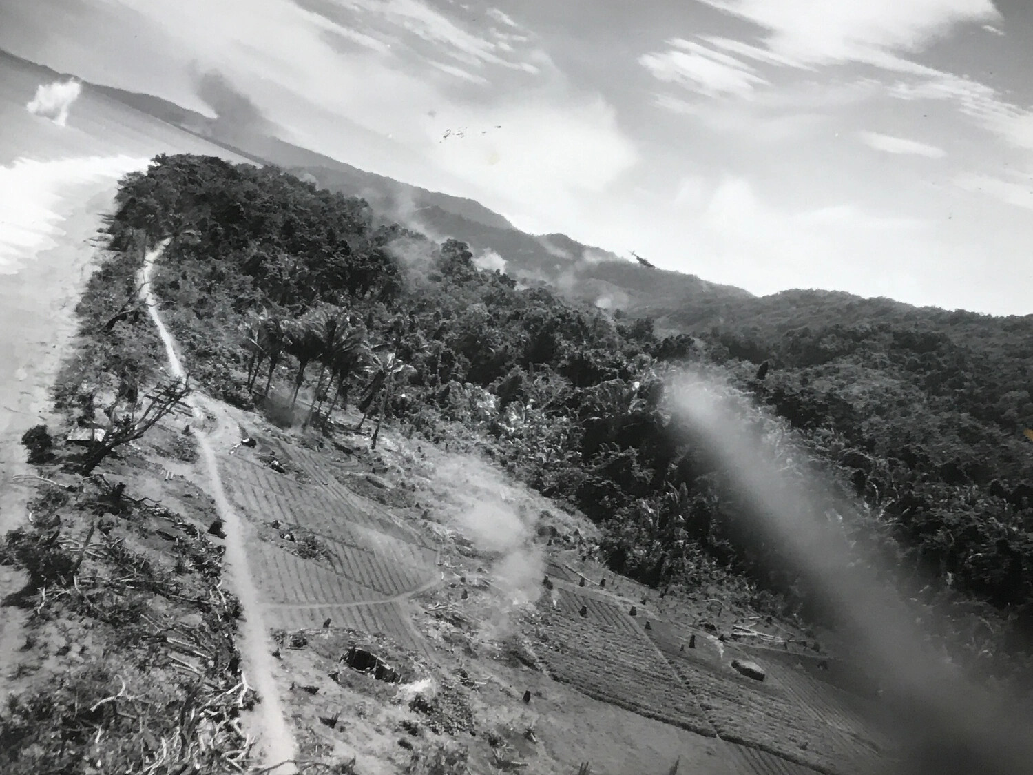 In-Flight Combat Photograph of Low-Level Strike on Coastal Jungle Target, 312th Bombardment Group, WWII Pacific Theater