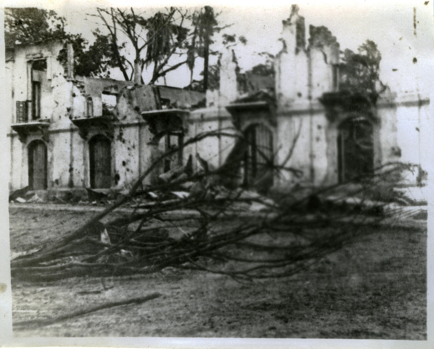 War-Damaged Colonial-Style Building with Downed Power Lines, Pacific Theater, WWII