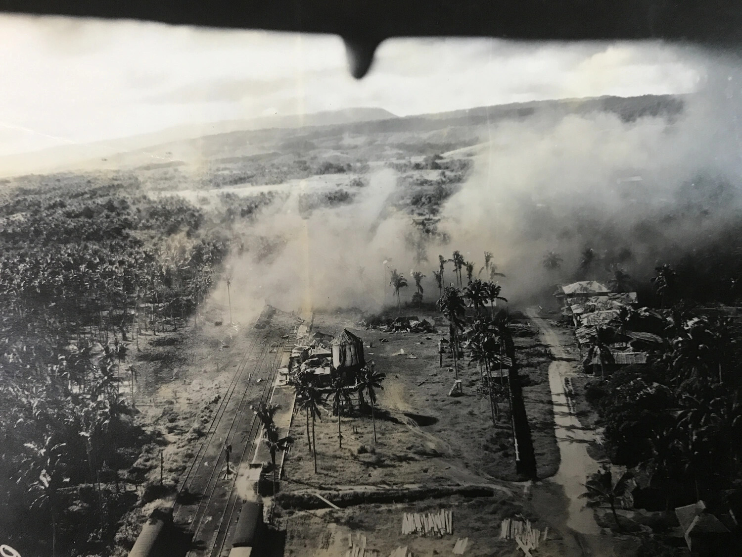 Village and Rail Line Engulfed in Smoke During Air Attack (Full Print), Pacific Theater