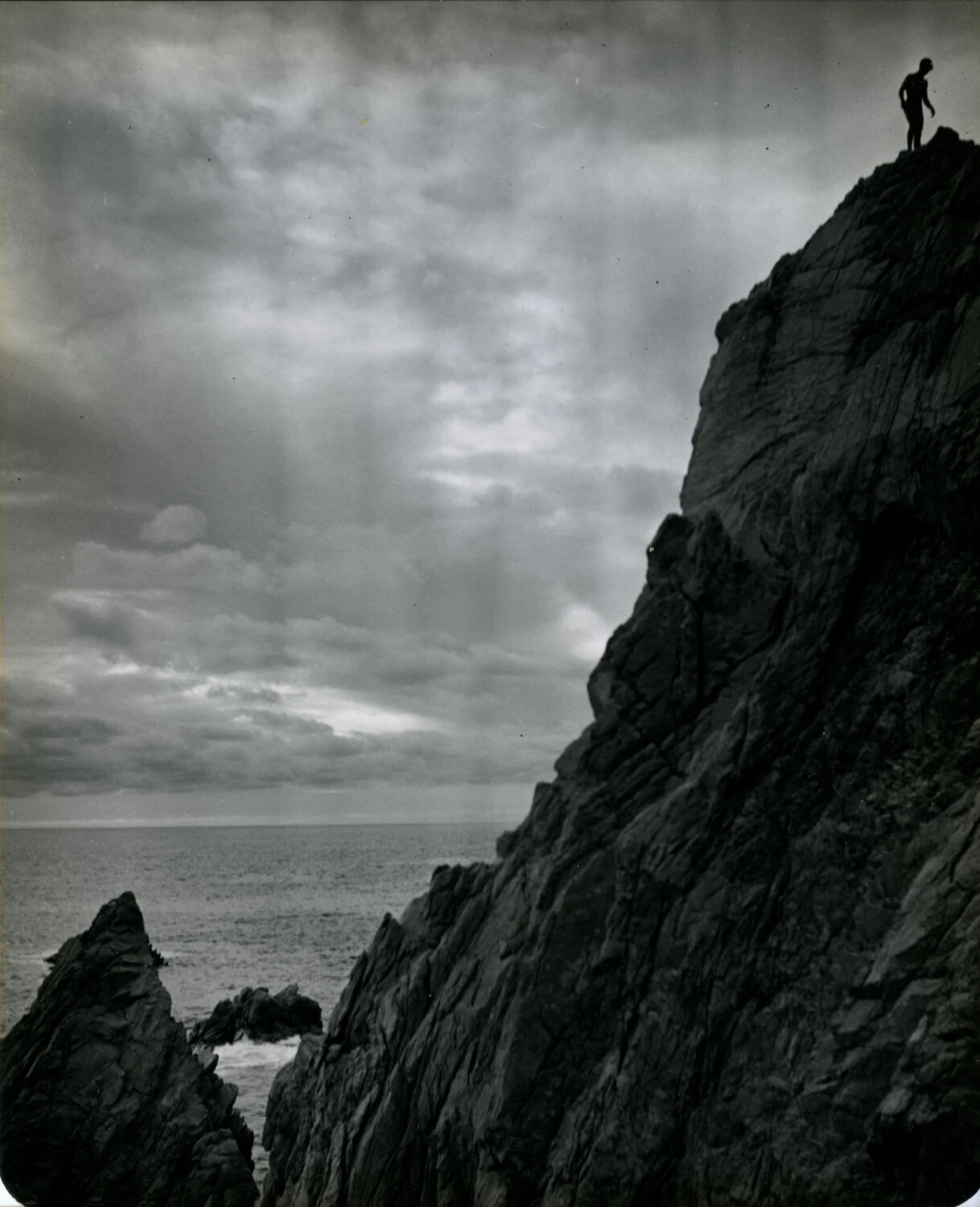 Cliff Diver Silhouette at La Quebrada, Wainwright Travel Album, circa 1949