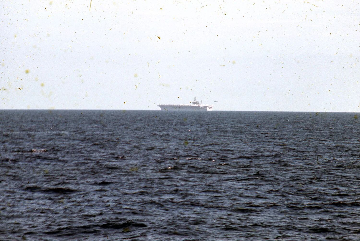 Distant View of Aircraft Carrier with Island Superstructure Visible, USS Ticonderoga, Vietnam War Era