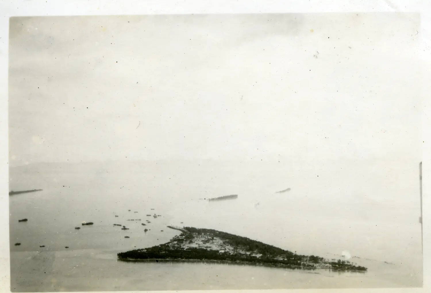 Aerial View of Tropical Islet with Surrounding Vessels, Pacific Theater, 312th Bombardment Group Collection, WWII