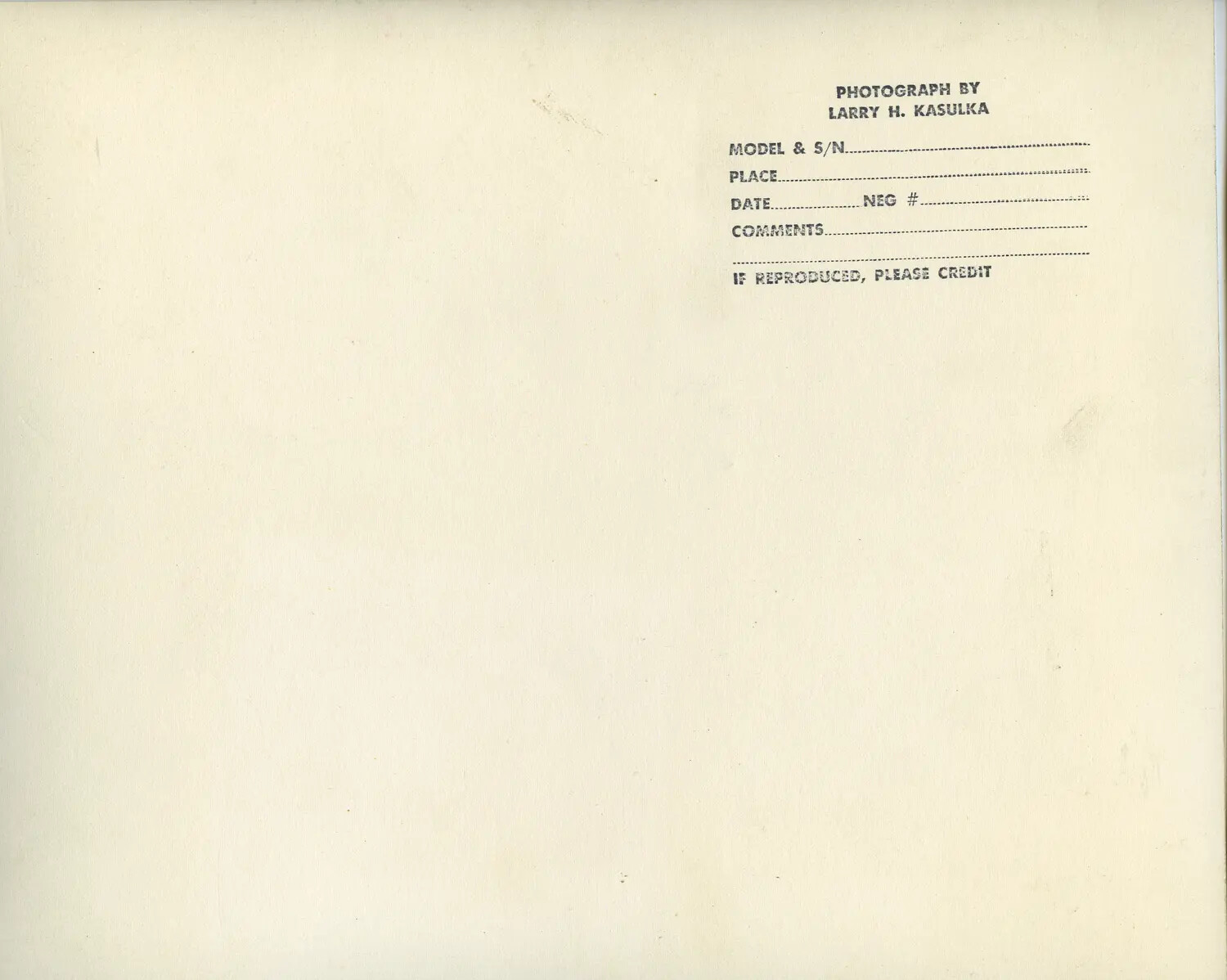 Verso of Photographic Print with Larry H. Kasulka Photographer's Credit Stamp