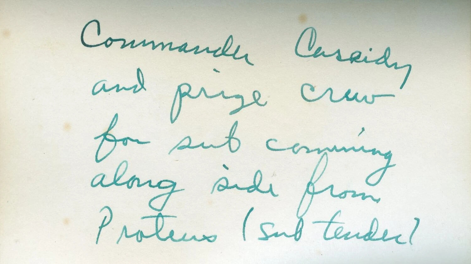 Handwritten Caption Card: 'Commander Cassidy and Prize Crew for Sub Coming Alongside from Proteus (Sub Tender)'