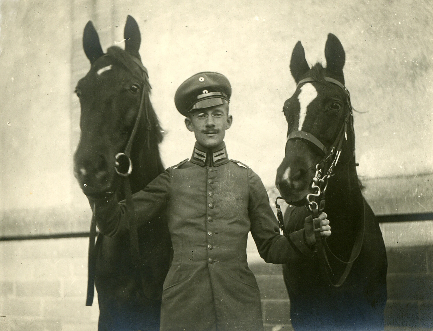 German Soldier Posed Between Two Horses, World War I