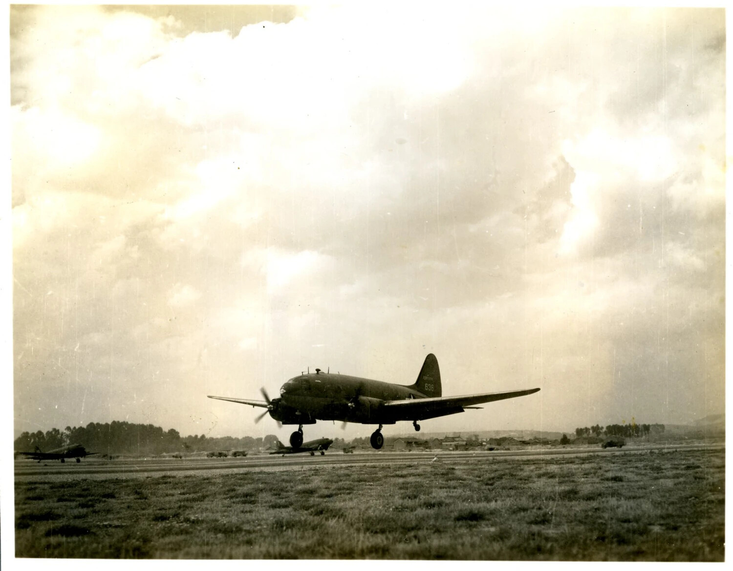 Twin-Engine Military Aircraft 'No. 636' in Flight over CBI Theater Airfield, World War II