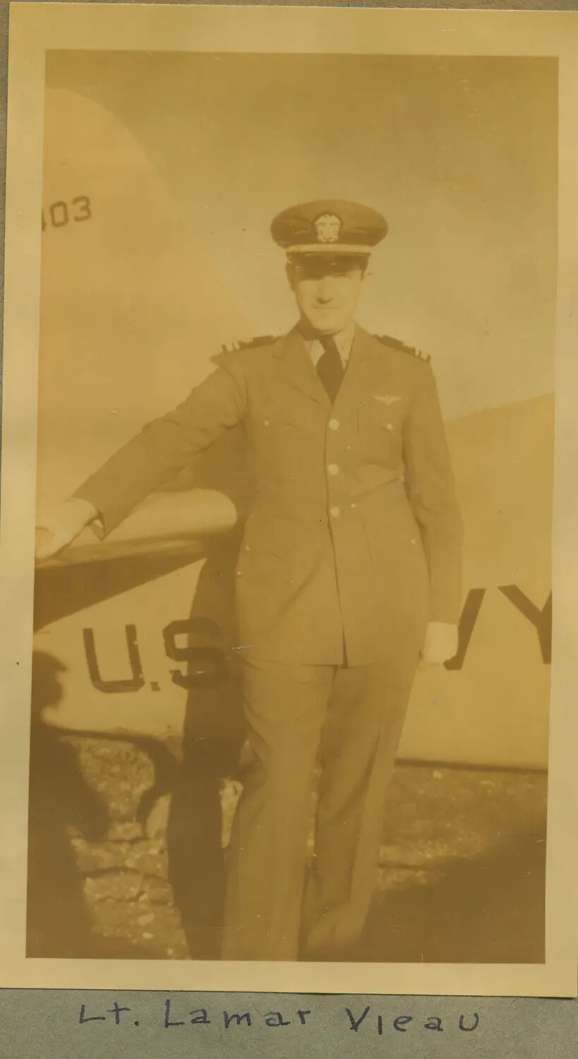 Portrait of Lt. Lamar Vieau, U.S. Navy Aviator, Beside Navy Aircraft