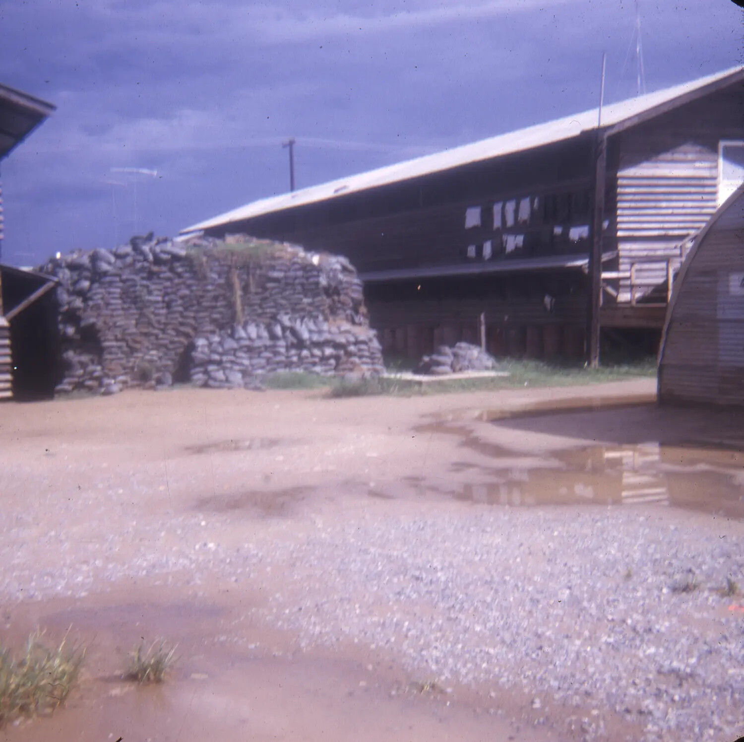 Sandbagged Bunker and Barracks at U.S. Military Base Camp, Vietnam War Era
