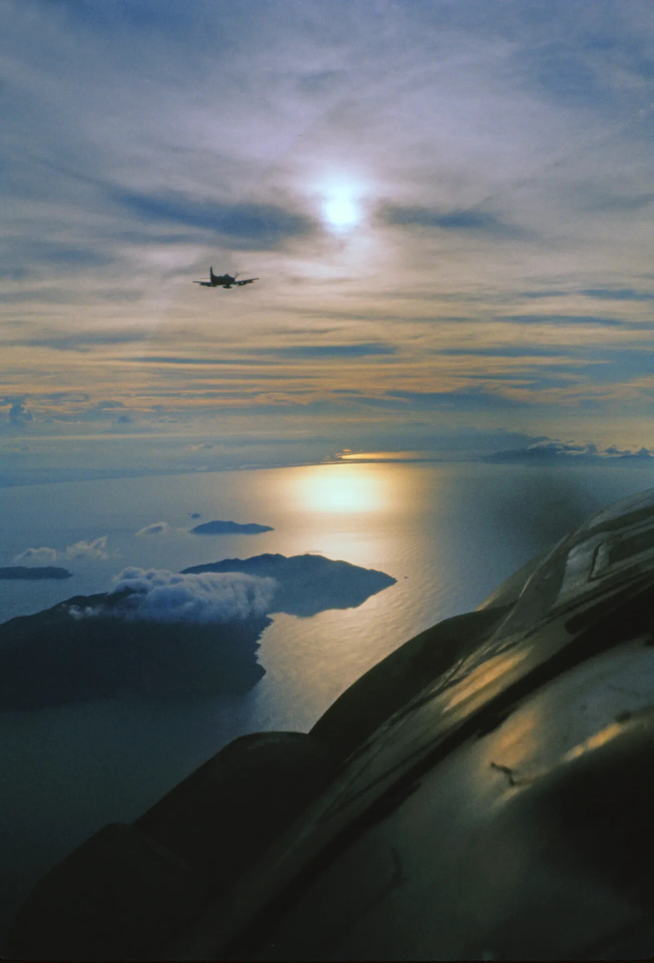 A-1 Skyraider Wingman in Formation Over Coastal Islands at Sunrise/Sunset, Vietnam War