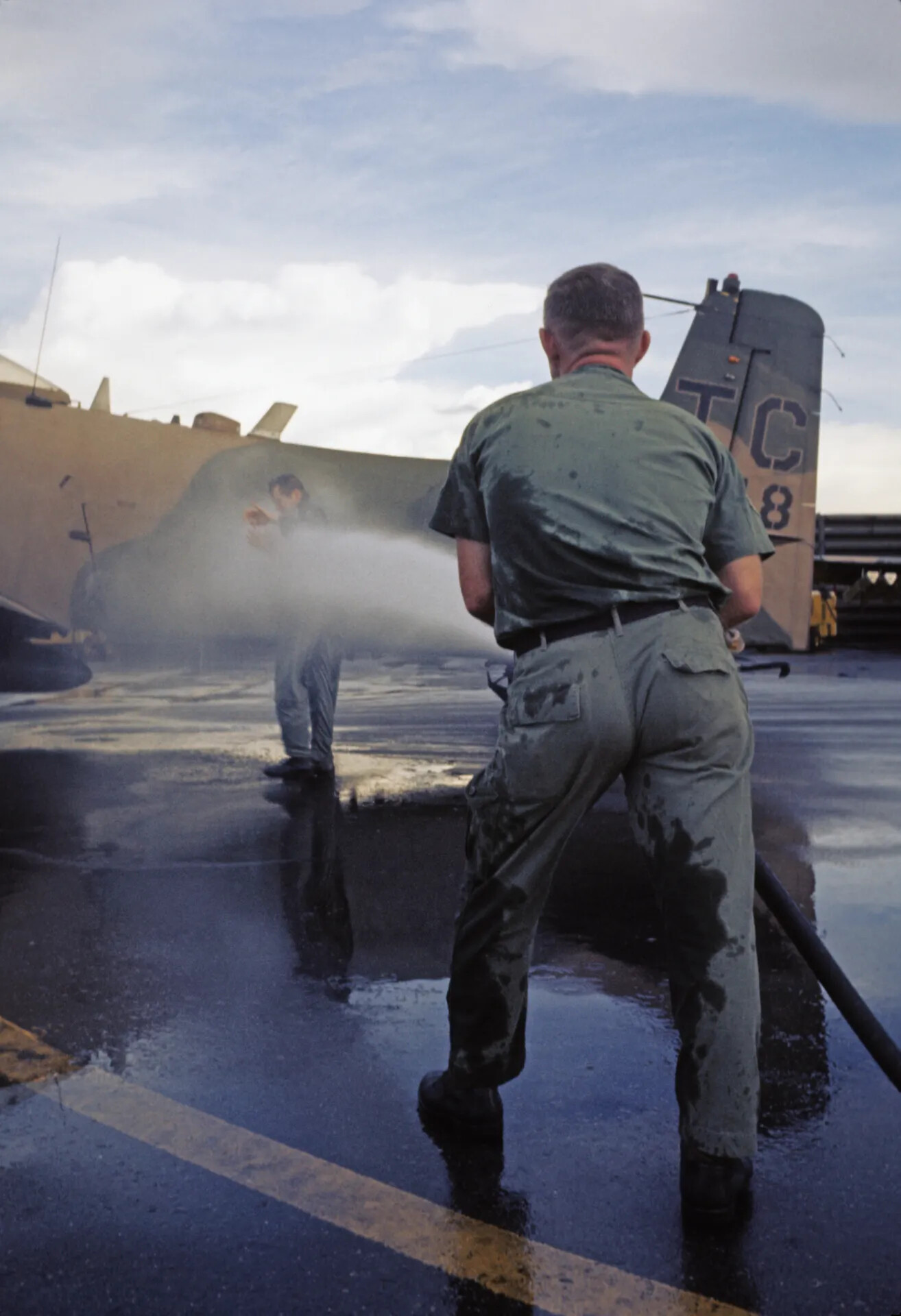 Ground Crew Washing SEA-Camouflaged Transport Aircraft, Don Engebretsen Collection — Vietnam War Era