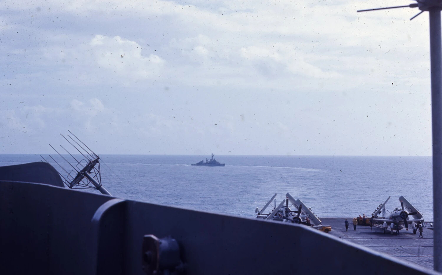 Flight Deck View with Escort Destroyer and Parked Skyraiders, USS Ticonderoga, Vietnam War Era