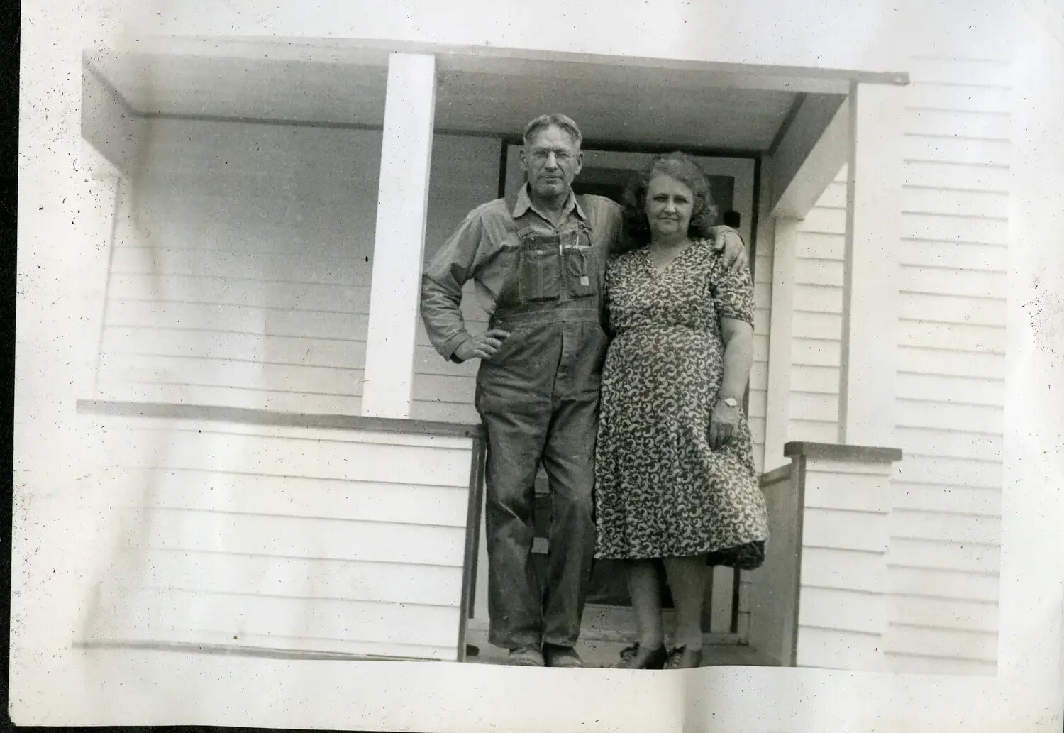 Civilian Couple on Farmhouse Porch, USS Maryland Sailor's Family Album, c. 1930s-1940s