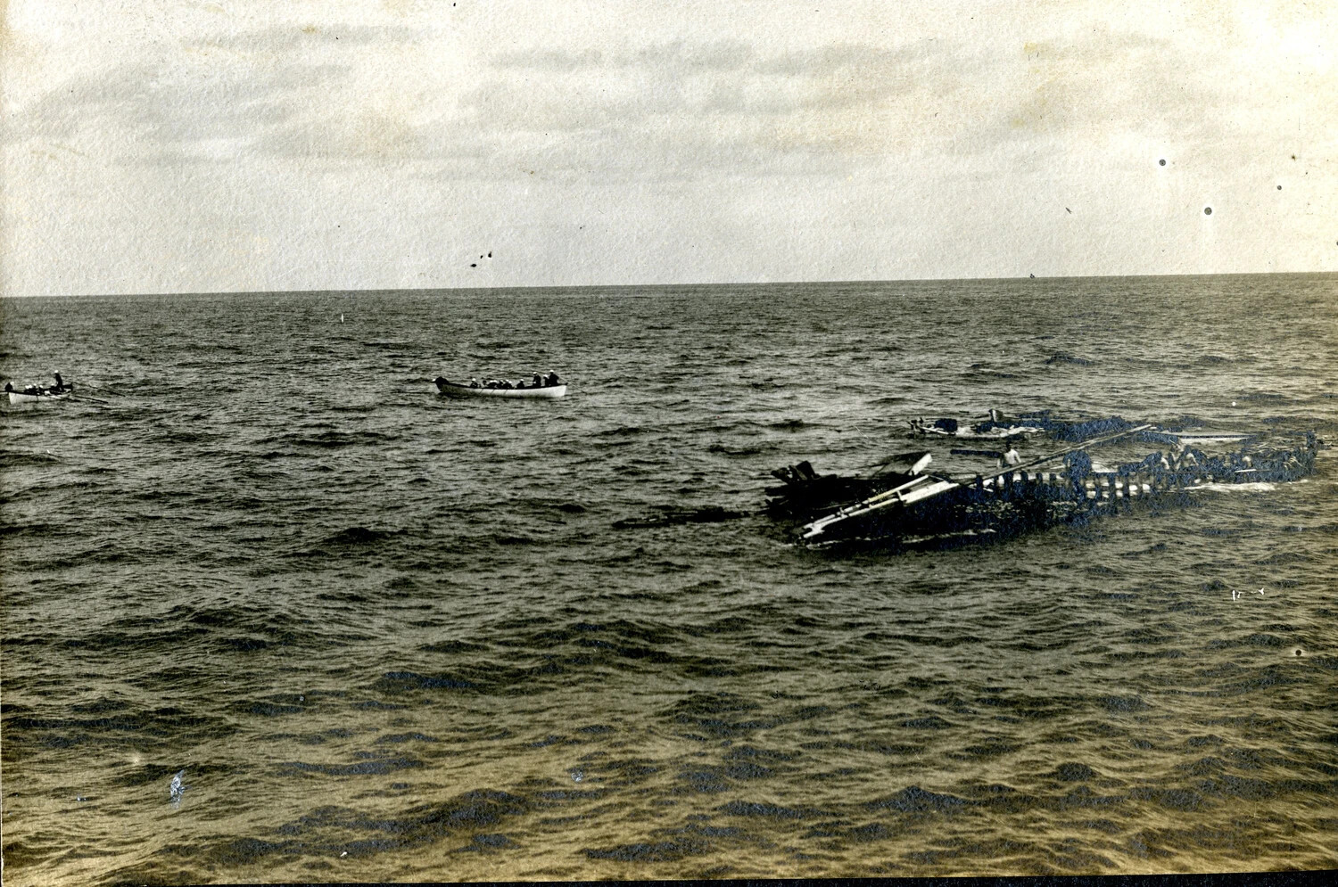 Rescue Operation at Sea: Small Boats Recovering Survivors from a Capsized Vessel, WWII Pacific Theater