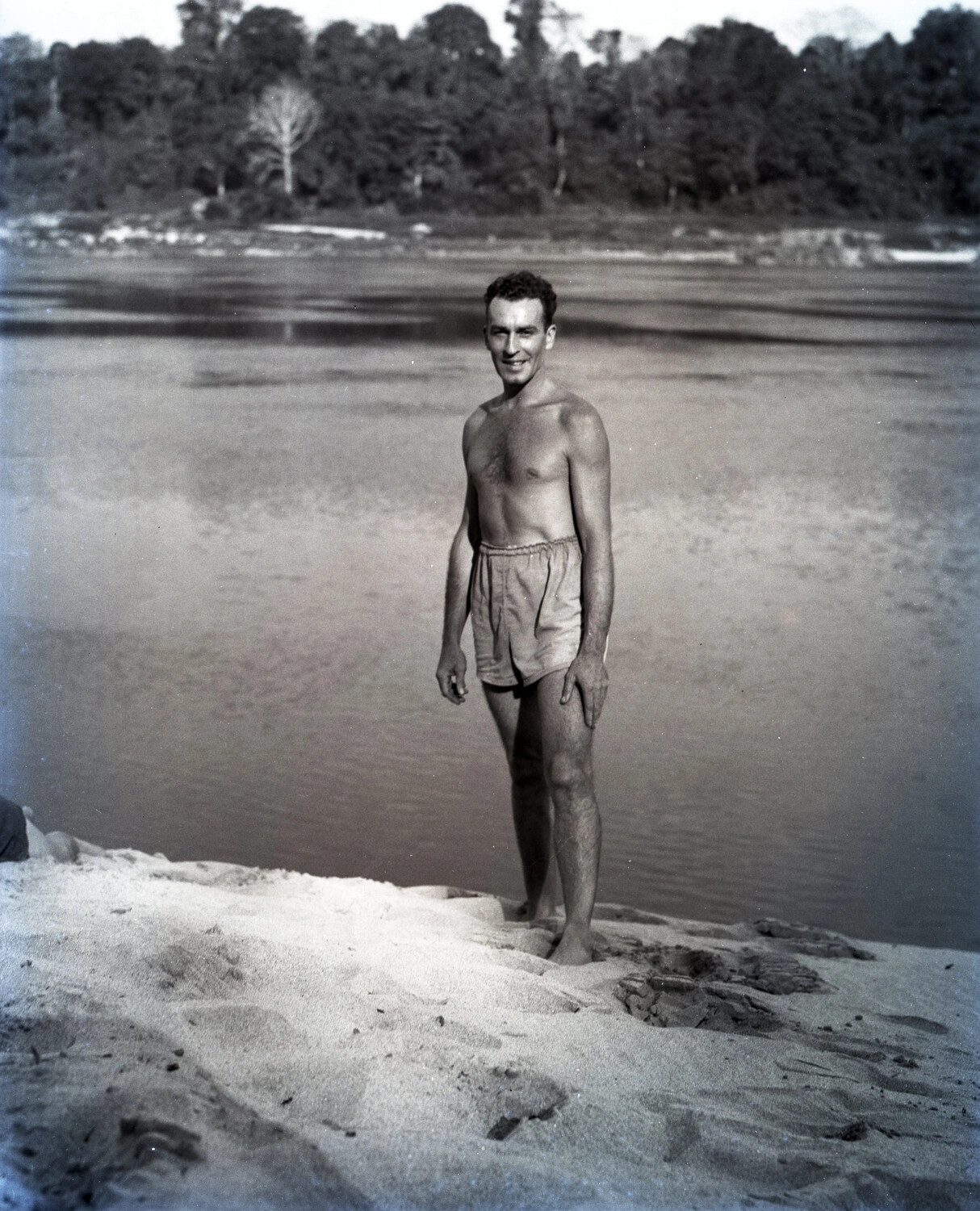 Serviceman Standing on Riverbank Sandbar, China-Burma-India Theater, WWII