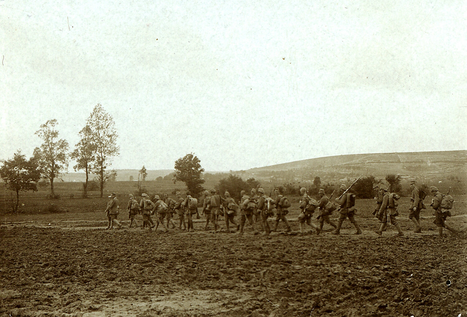 German Infantry Column Marching Across Plowed Field, WWI