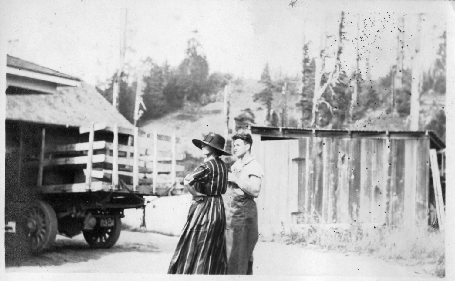 Couple Beside Flatbed Truck at Rural Homestead — Presidio Photo Album, Early 20th Century