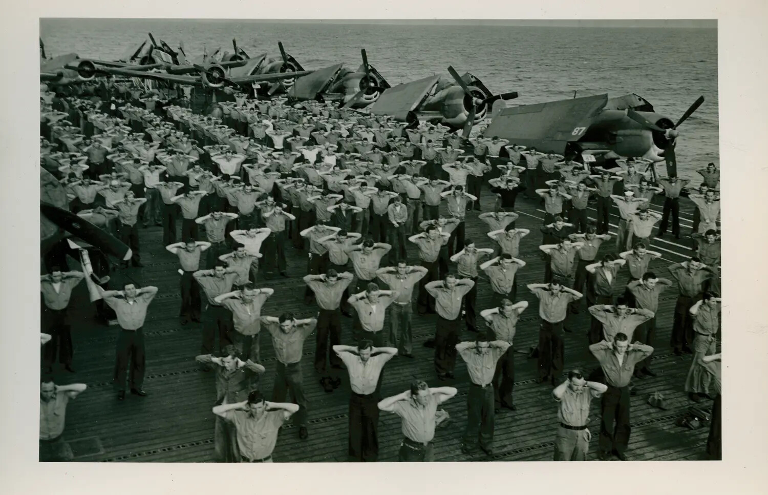 Mass Calisthenics on the Flight Deck of USS Petrof Bay (CVE-80), WWII Pacific Theater