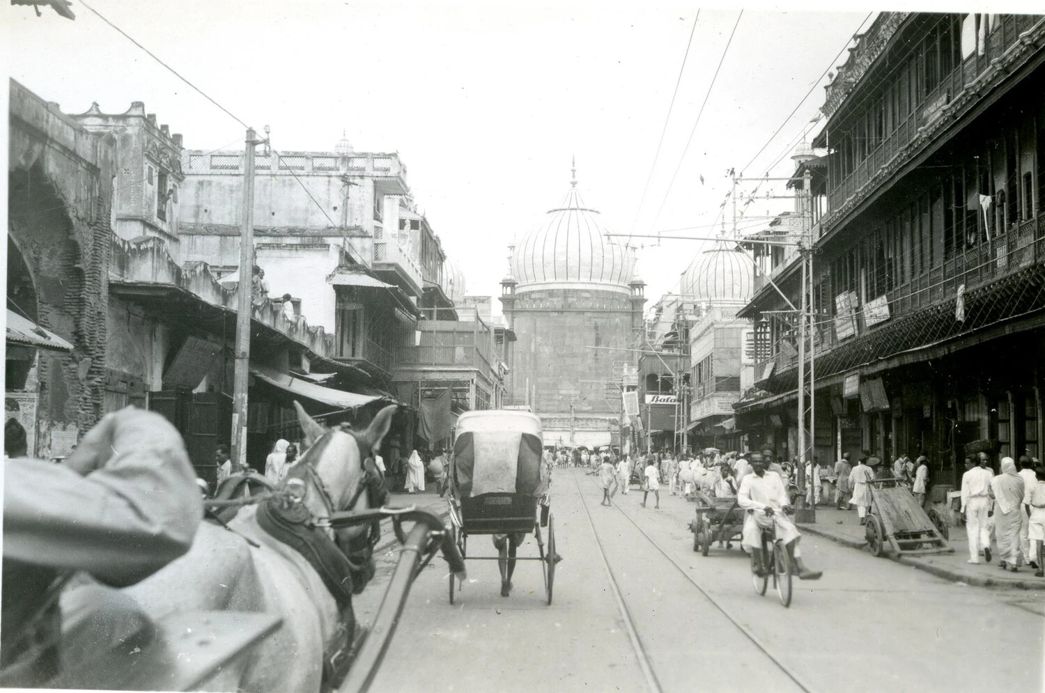 Street Scene with Horse-Drawn Carriages Near Domed Mosque, India, World War II Era