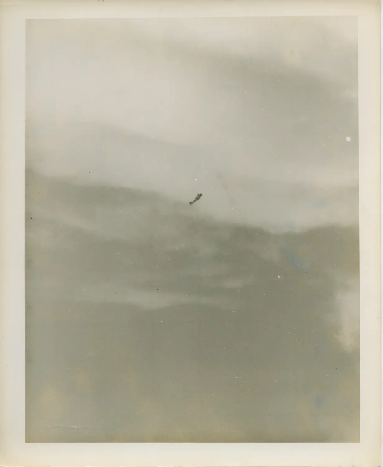 Possible Photograph of Japanese Kamikaze Aircraft Diving on USS Suwannee (CVE-27), 25 October 1944 - Taken from USS Petrof Bay (CVE-80)
