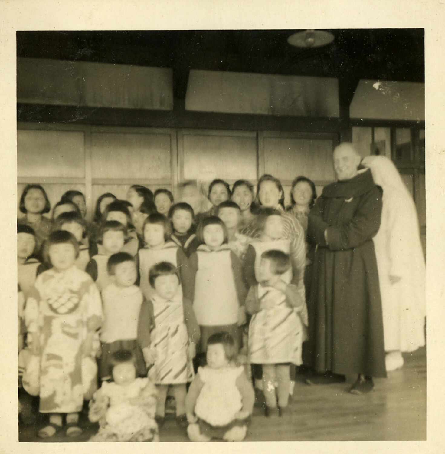 Group Portrait of Japanese Children with Catholic Religious Brother and Nun, Postwar Japan