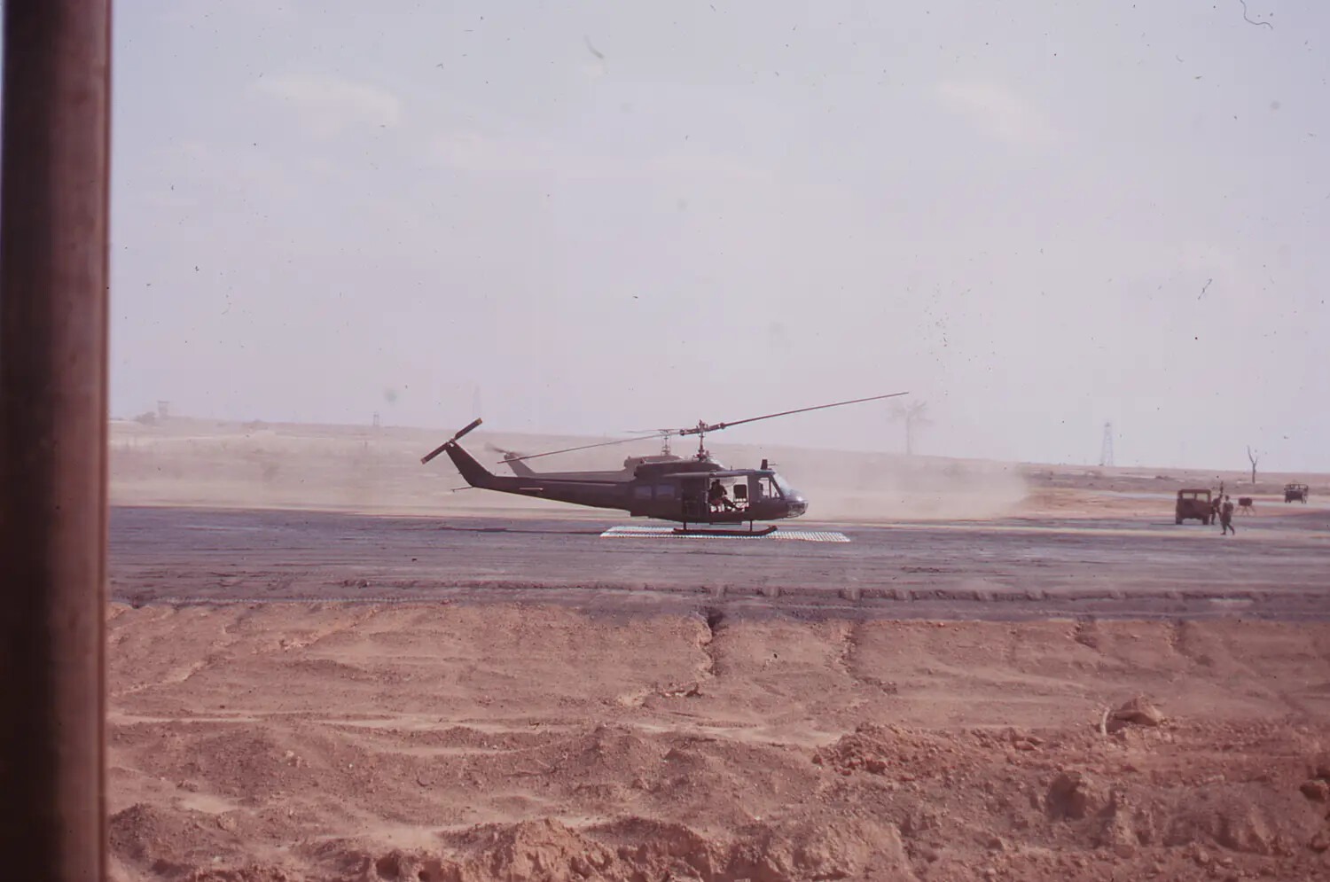 UH-1 'Huey'-Type Helicopter on PSP Landing Pad, Vietnam, 1968 (Tet Offensive Era)
