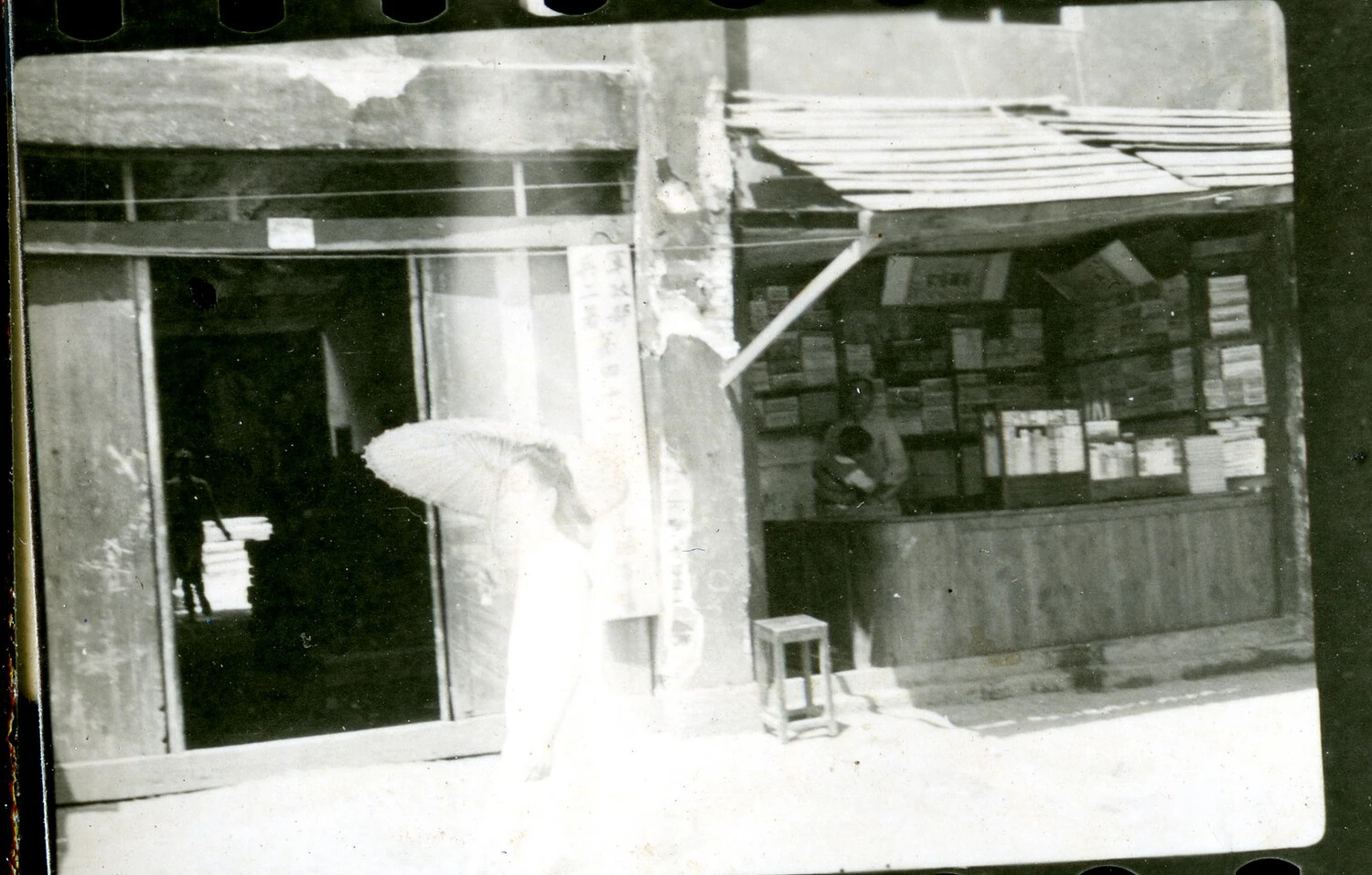 Street Vendor Stall and Pedestrian with Parasol, Burma/CBI Theater Collection