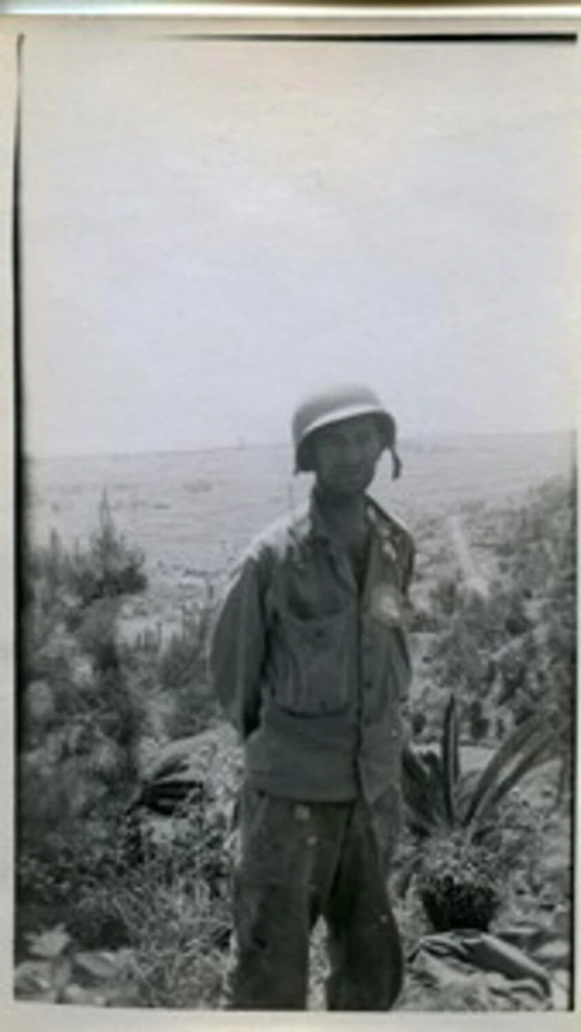 American Soldier on Hillside in Field Uniform – Joe Vieira WWII Photo Collection