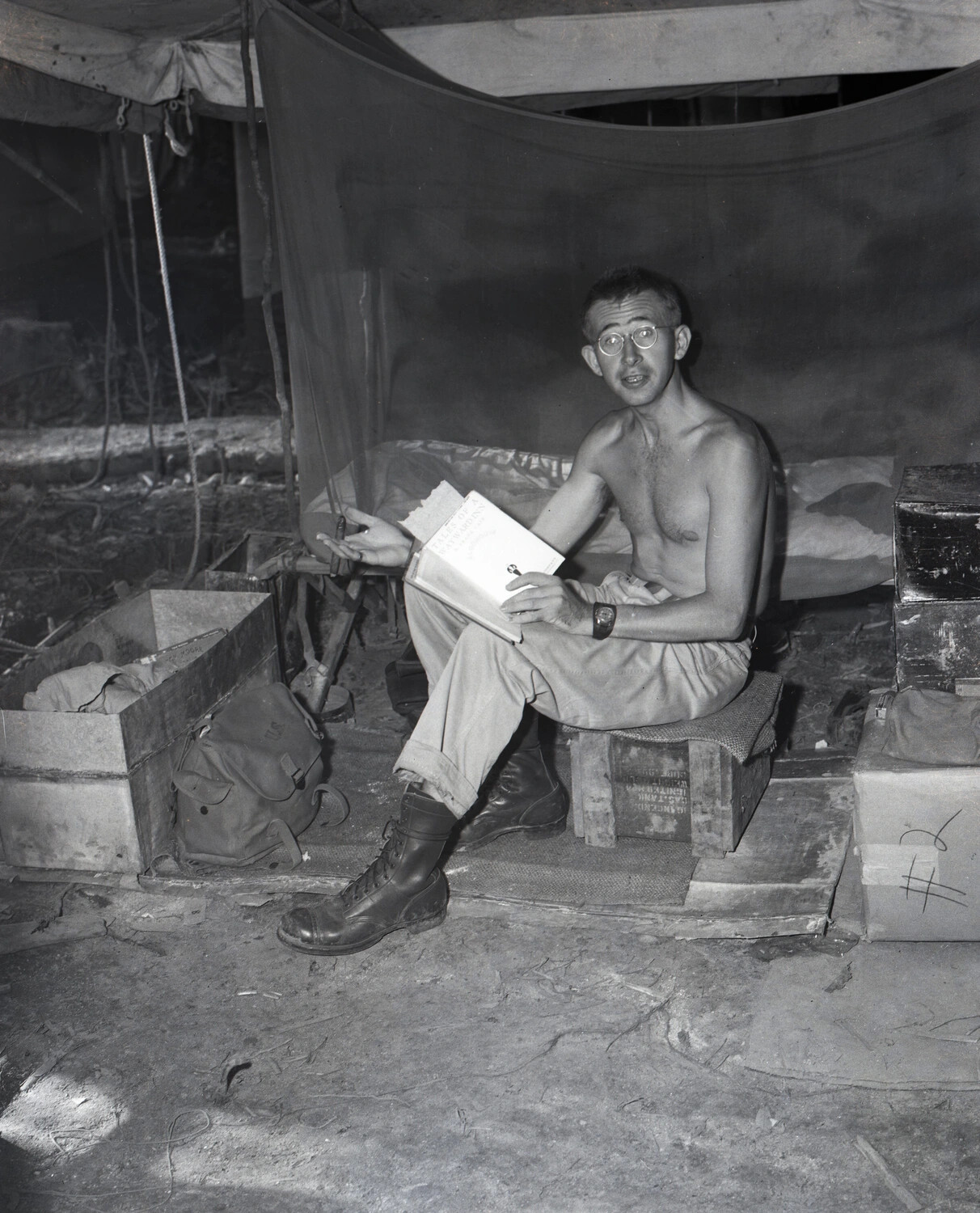 Shirtless GI Reading in Tent Quarters, China-Burma-India Theater, WWII