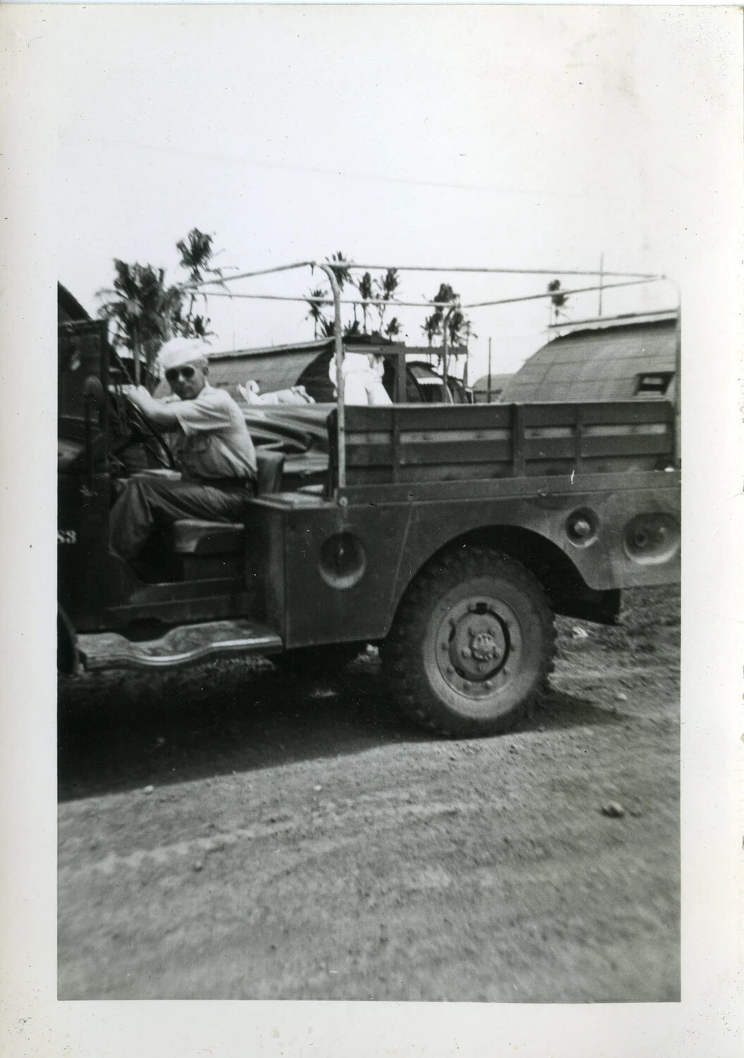 Serviceman in Military Cargo Truck, Naval Air Transport Squadron (VR-6), Agana, Guam