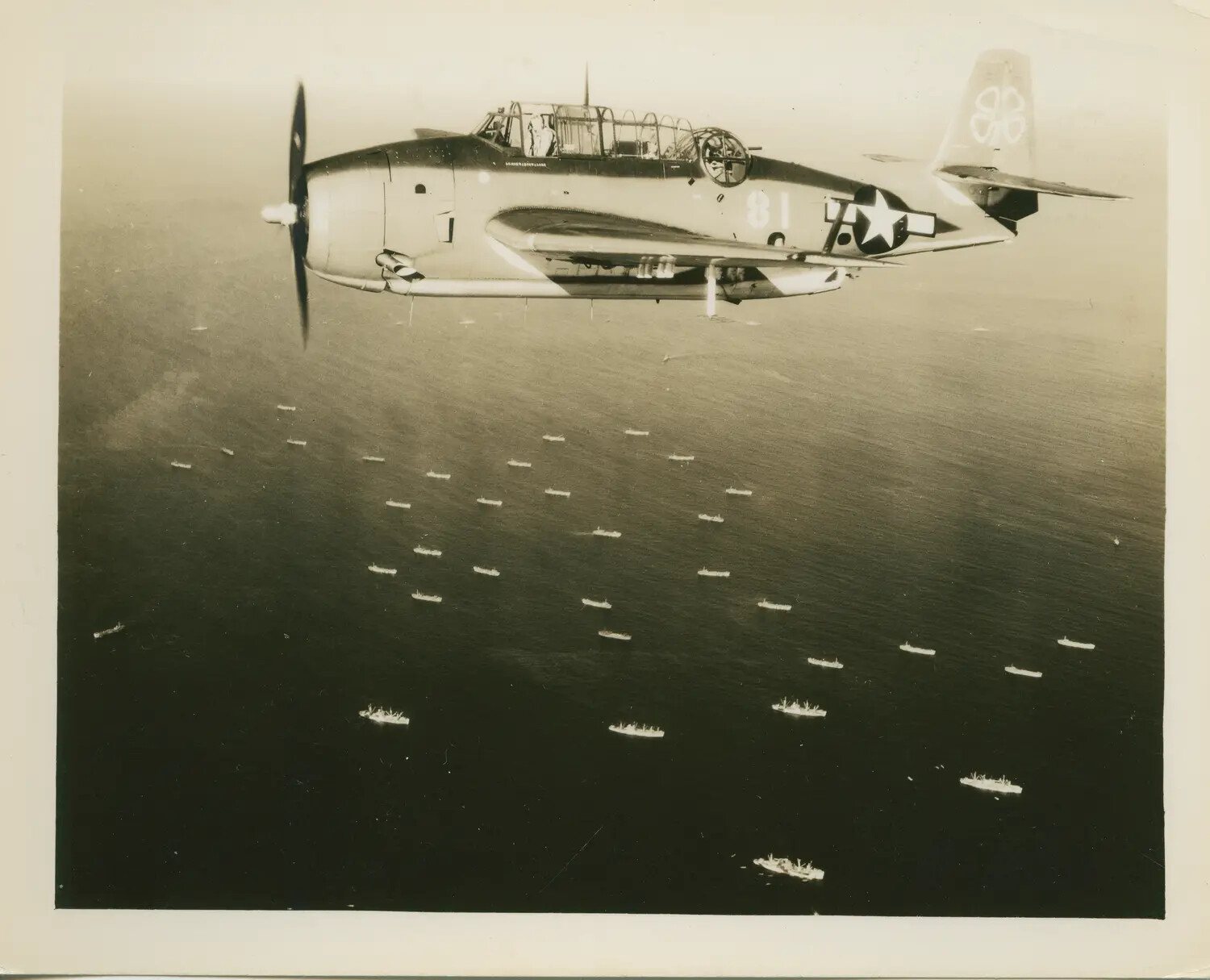 TBM/TBF Avenger in Flight Over Invasion Fleet, USS Petrof Bay (CVE-80) Collection, WWII Pacific
