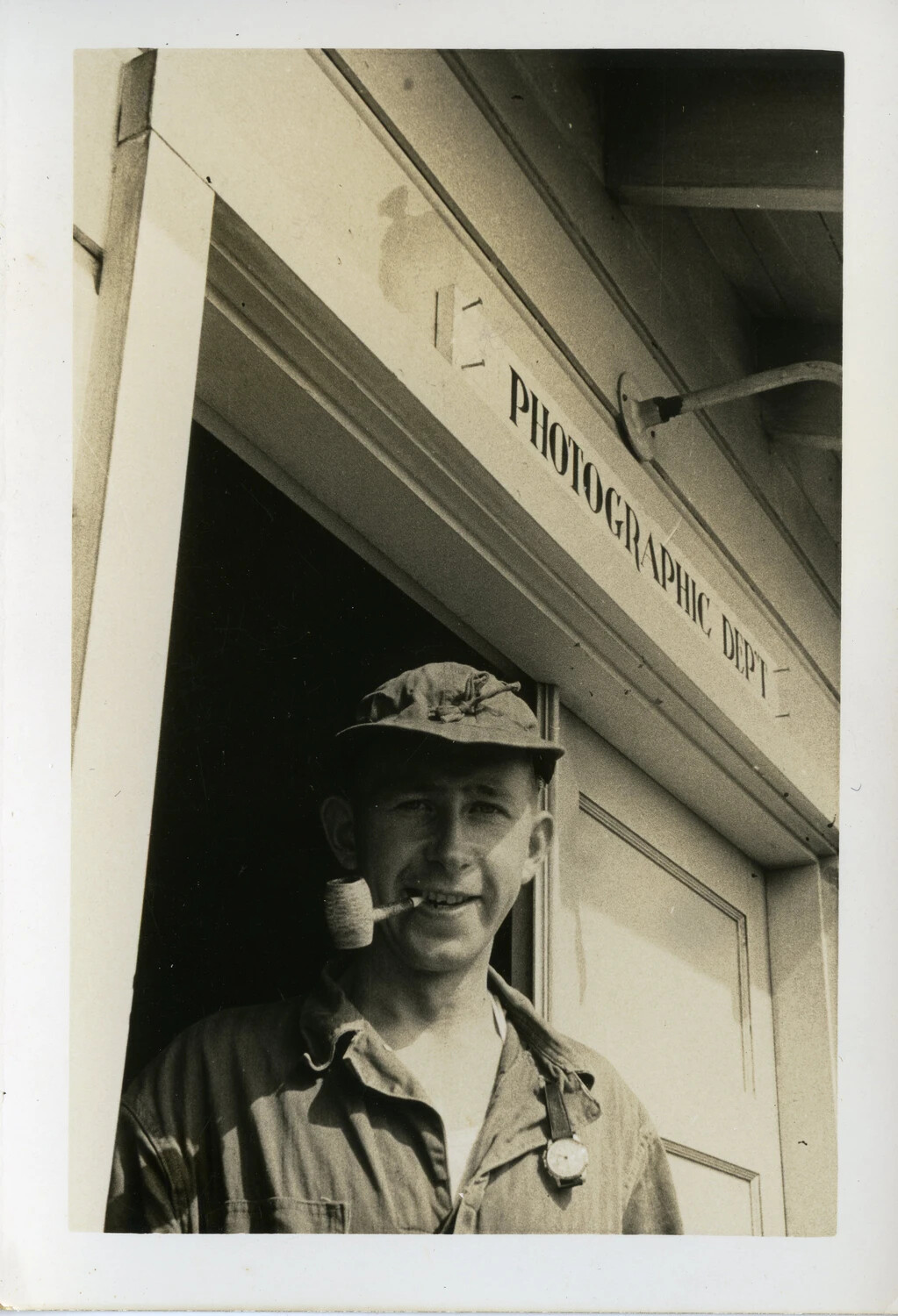 Serviceman at "Photographic Dep't" Entrance, CBI Theater, WWII