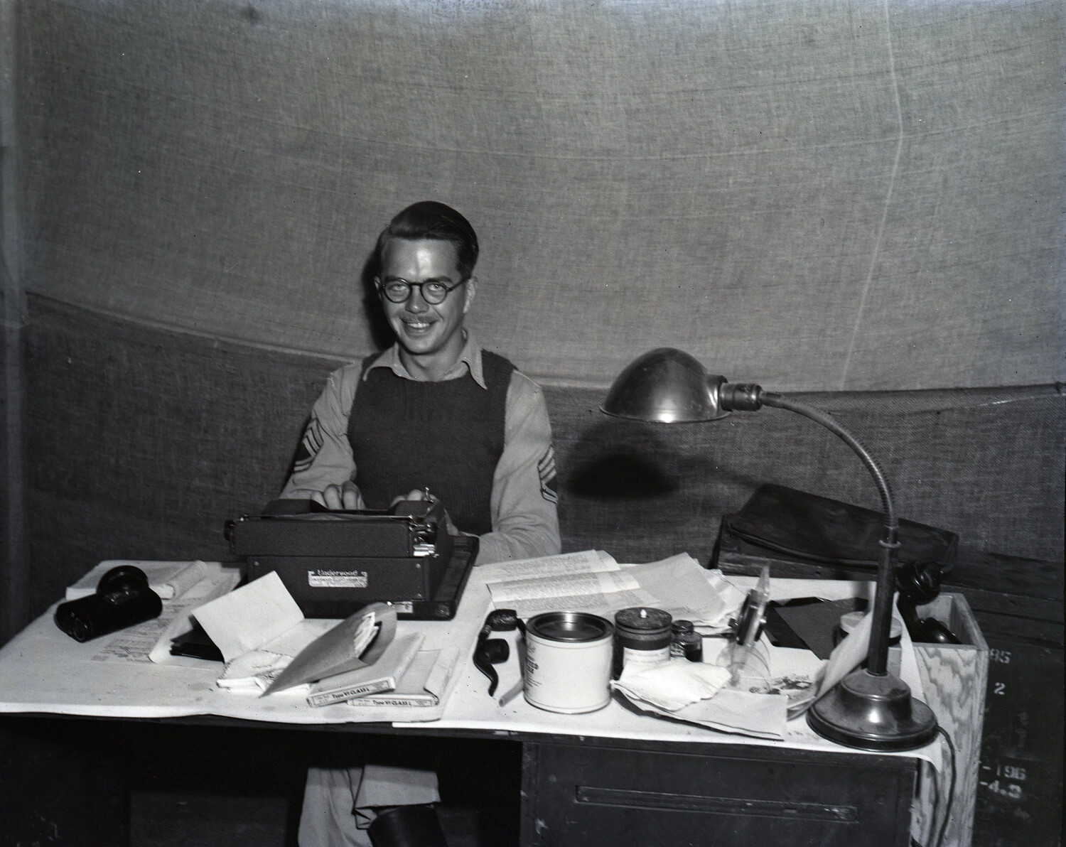 U.S. Army Sergeant Typing at Field Desk, Photographic/Administrative Tent — Myitkyina, Burma, WWII Kotec Collection